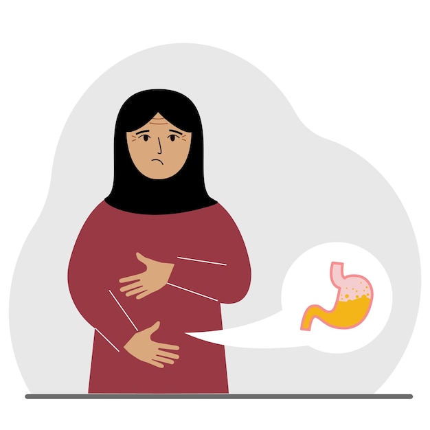 El concepto de dolor en el abdomen La mujer árabe sostiene su estómago con ambas manos Problemas con el estómago o la digestión