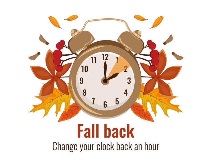 Concepto de horario de verano paisaje otoñal con texto Fall Back mano pasando al horario de invierno