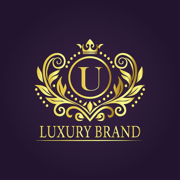 El concepto del logotipo de oro de lujo de la letra U
