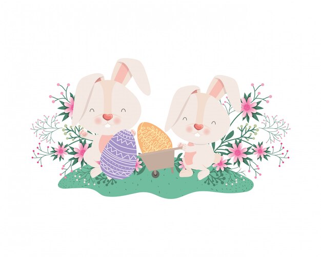 Conejos con icono de carretilla y huevos de pascua.