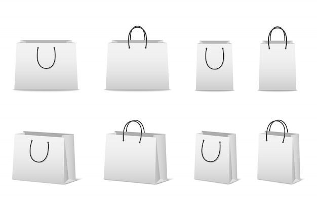 Conjunto de bolsas de papel en blanco aislado en blanco