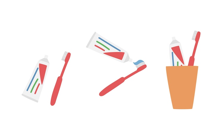 Vector conjunto de cepillo de dientes y pasta de dientes en una taza en la ilustración de vector de estilo plano, estilo de dibujos animados de imágenes prediseñadas
