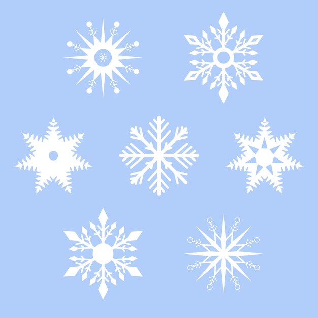 Conjunto de copos de nieve blancos sobre un fondo azul.