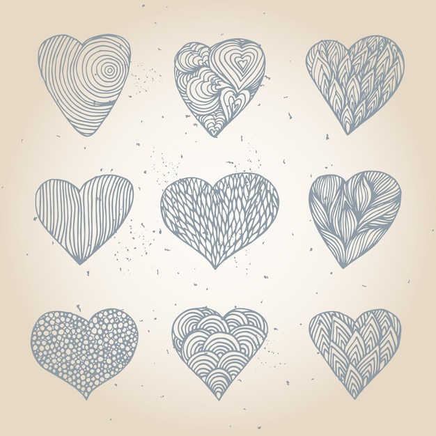 Conjunto de corazones dibujados a mano con patrón diferente.