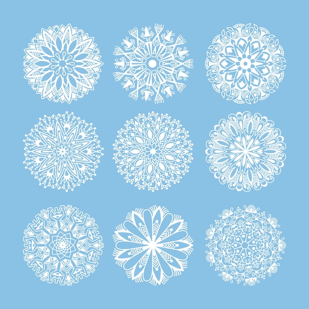 Conjunto de decoración de copos de nieve de Navidad aislado en encaje de círculo azul redondo ornamental