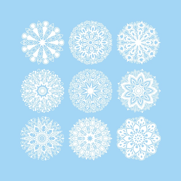 Conjunto de decoración de copos de nieve de Navidad aislado en encaje de círculo azul redondo ornamental