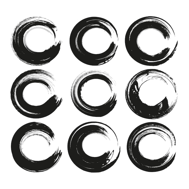 Conjunto de frotis texturizados abstractos de círculo negro aislados en un fondo blanco