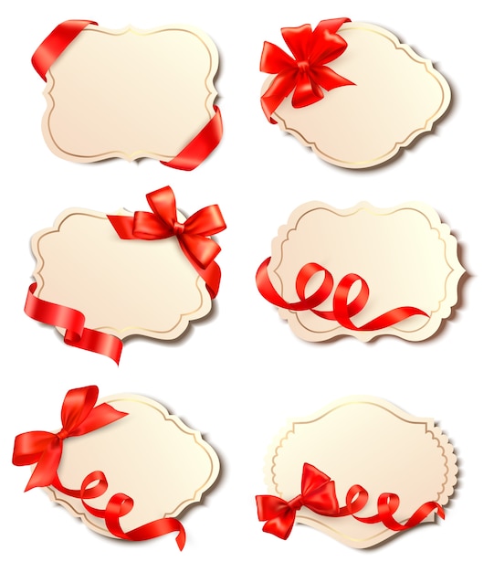 Conjunto de hermosas tarjetas con moños de regalo rojos con cintas