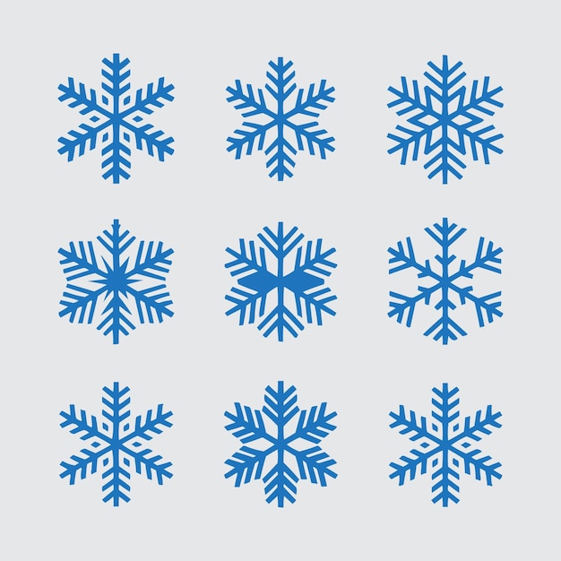 Los copos de nieve de Navidad son de color azul claro sobre un fondo blanco