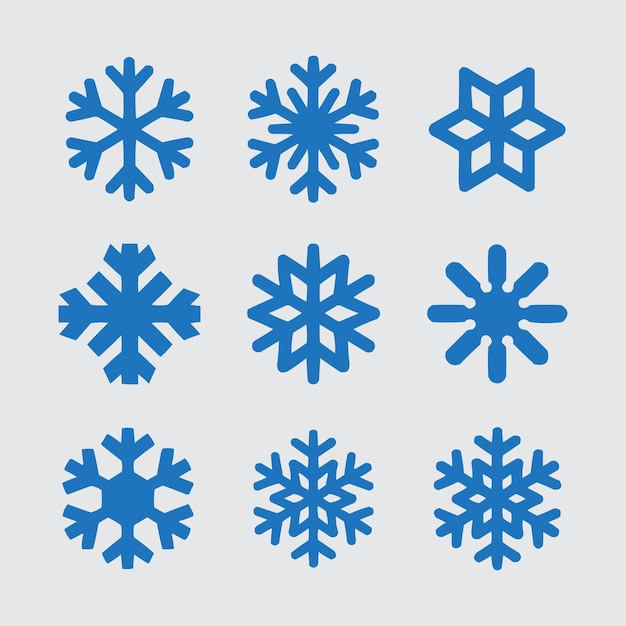 Los copos de nieve de Navidad son de color azul claro sobre un fondo blanco