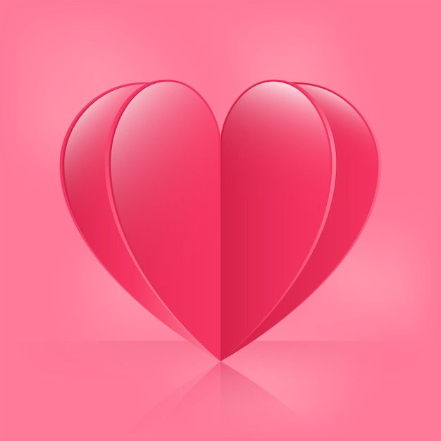 Corazón de papel 3D sobre fondo rosa.