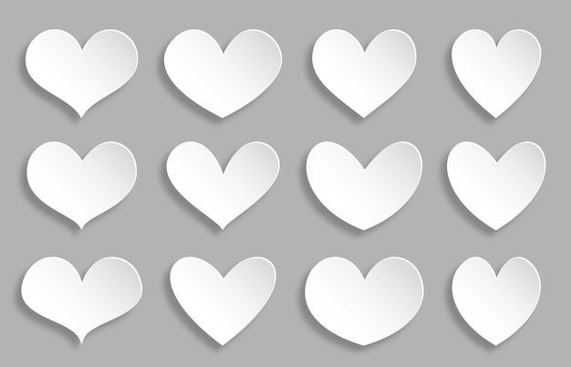 Corazón papel blanco cortado conjunto de iconos de romance símbolo de amor corazones diferentes formas pegatina en blanco sobre fondo gris plantilla de invitación de boda elemento de decoración de tarjeta de día de san valentín