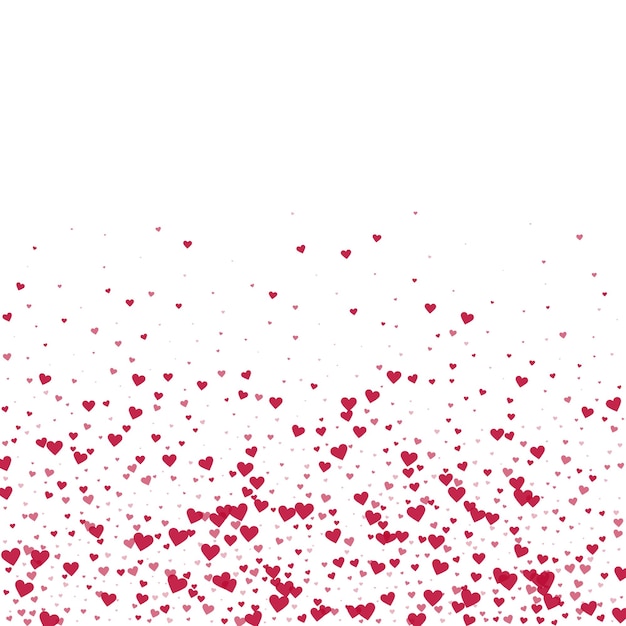 Corazones rojos esparcidos sobre un fondo blanco