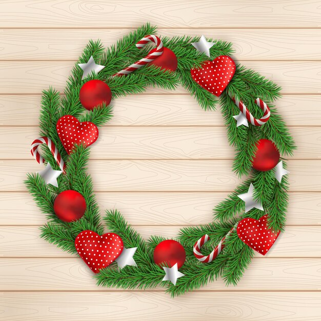 Corona de Navidad sobre fondo de textura de madera