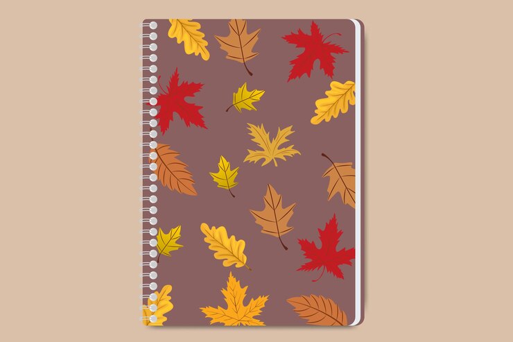 Vector cuaderno de otoño con colorido patrón de hojas que caen en una portada de espiral marrón