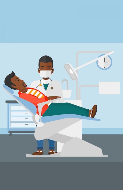 Dentista y hombre en silla de dentista.