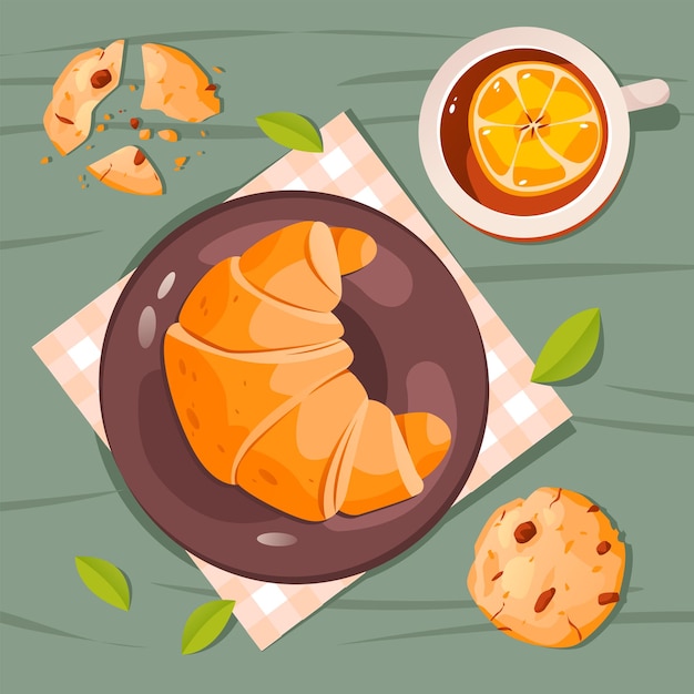 Desayuno con croissant y una taza de té de limón sobre la mesa desayuno tradicional francés