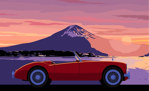 Descapotable rojo Retromobile contra la puesta del sol