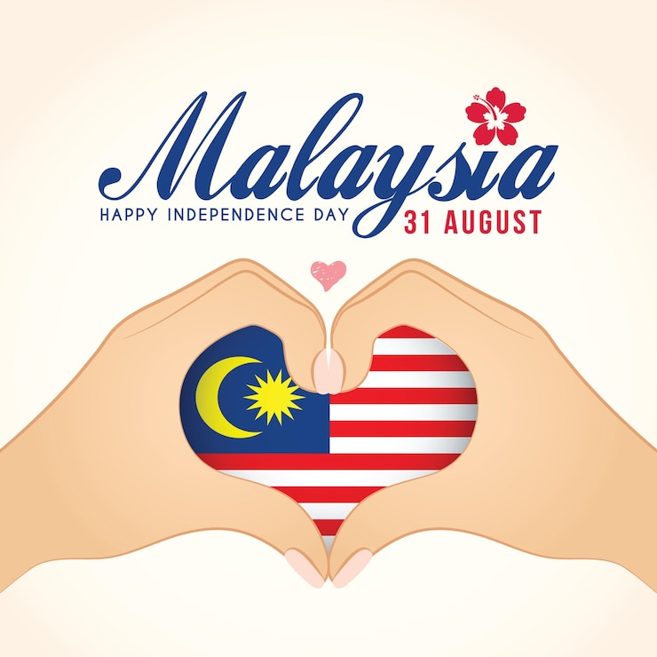 Día nacional de Malasia - dos manos haciendo gestos en forma de corazón con la bandera de Malasia.