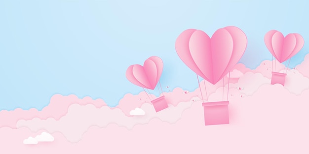 Día de San Valentín amor conceptopapel rosa en forma de corazón globos de aire caliente flotando en el cielo con nubes