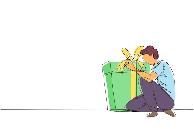 Un dibujo continuo de una línea de un hombre caucásico alegre abrazando un enorme regalo de cumpleaños. Vector masculino satisfecho.