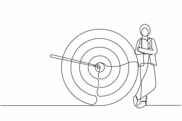 Dibujo continuo de una línea mujer de negocios árabe de pie junto al objetivo negocio exitoso