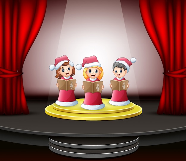 Dibujos animados de niños cantando villancicos en el escenario.