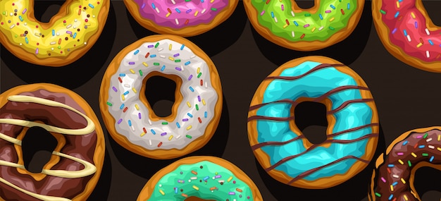 Donuts de colores sobre fondo negro