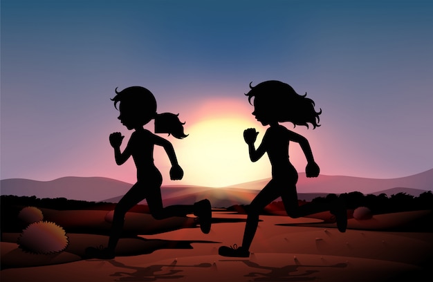 Dos chicas corriendo en el campo al atardecer