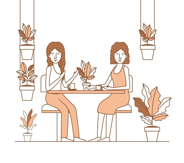 dos mujeres beben café en el jardín