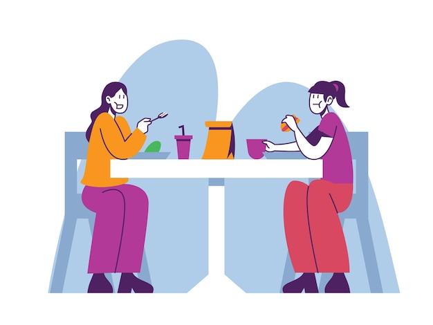 dos niñas almorzando en la escuela