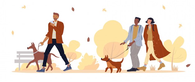 Dueño de la mascota pasear al perro en el parque otoño bajo caída de hojas