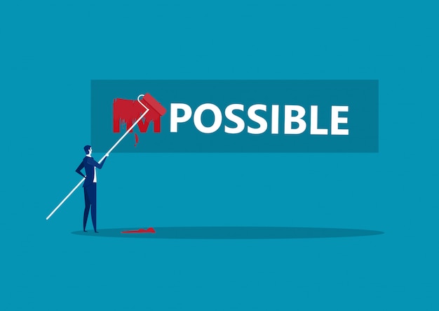empresario cambiando la palabra imposible a posible con color rojo