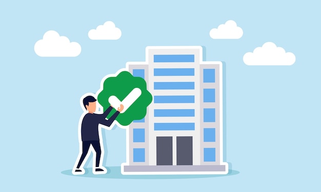 Empresario con una marca de comprobación al lado del edificio de la empresa que representa la verificación y validación oficial de la empresa