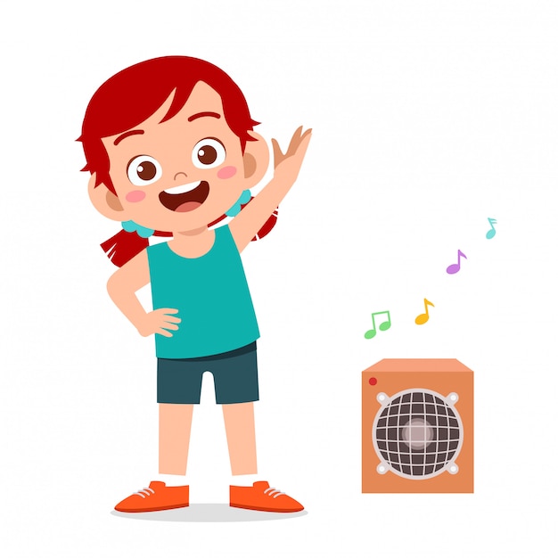 Entrenamiento de niña linda feliz niño con escuchar música