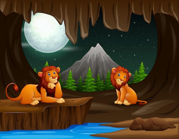 Escena con dos leones en la cueva por la noche.