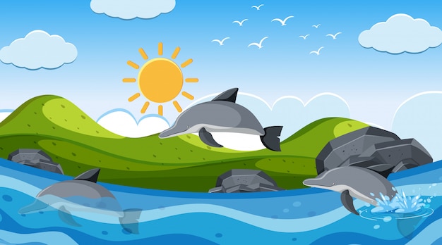 Escena de fondo con delfines nadando en el mar
