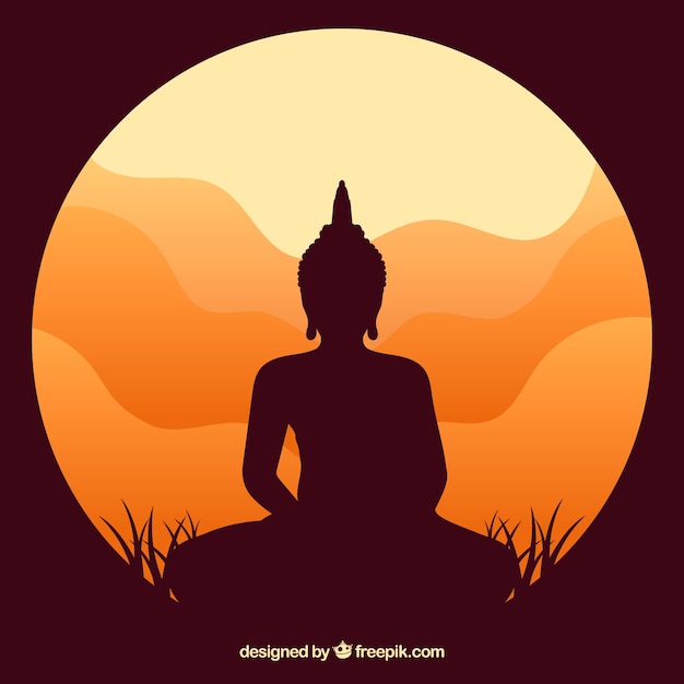 Estatua de la silueta de buda con puesta de sol