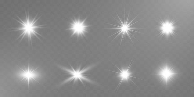 Las estrellas brillantes brillan rayas de luz y partículas brillantes en un fondo transparente