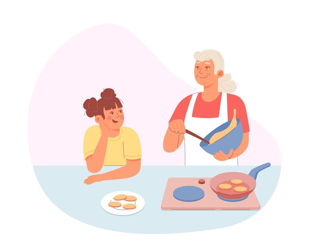 Familias cocinando en la cocina Una anciana y su nieta preparando galletas