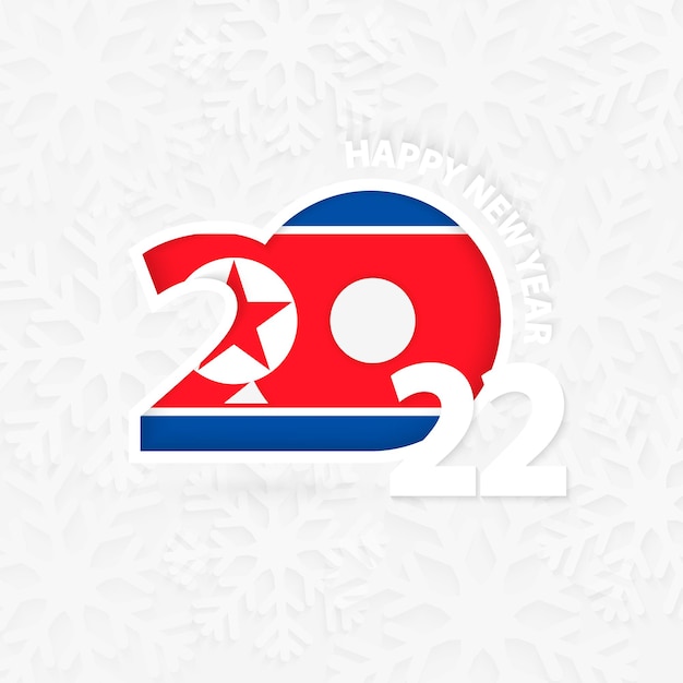 Feliz año nuevo 2022 para corea del norte sobre fondo de copo de nieve.