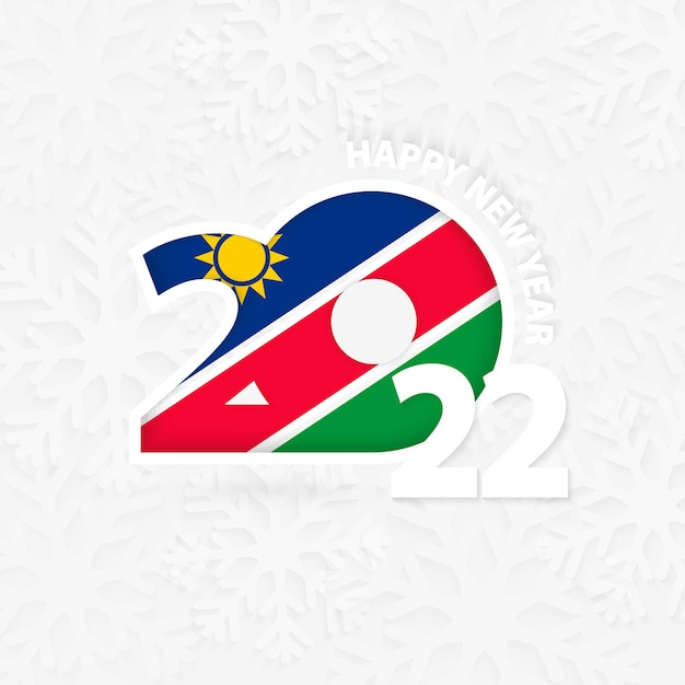 Vector feliz año nuevo 2022 para namibia sobre fondo de copo de nieve.