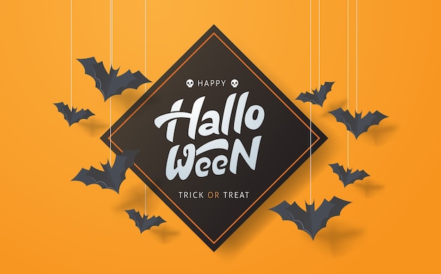 Feliz caligrafía de halloween con murciélagos de papel volando.