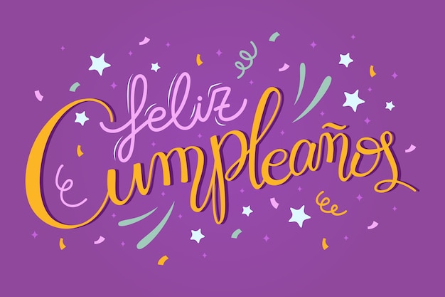 Feliz cumpleaños en letras españolas con fuegos artificiales