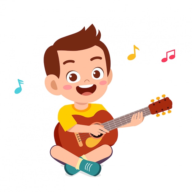 Feliz lindo niño pequeño niño tocar la guitarra