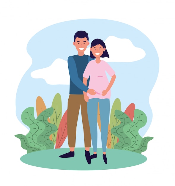Feliz mujer y hombre pareja embarazada y plantas