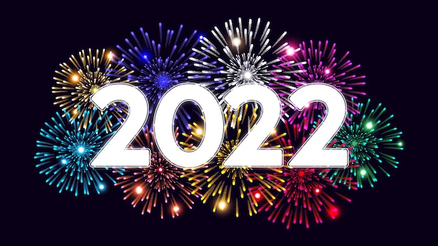 Feliz navidad y próspero año nuevo 2022 sobre fondo oscuro con fuegos artificiales