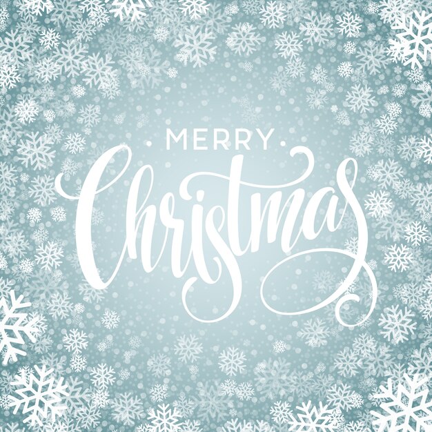 Feliz Navidad texto escrito a mano sobre fondo con copos de nieve