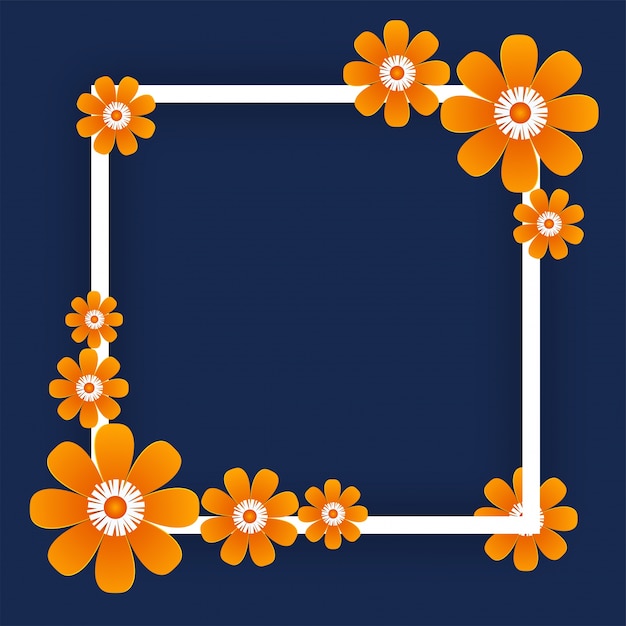 Flores de papel naranja con marco cuadrado sobre fondo azul.