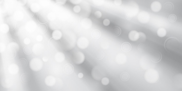 Fondo abstracto en colores blanco y gris con rayos divergentes de luz y pequeños círculos translúcidos con efecto bokeh